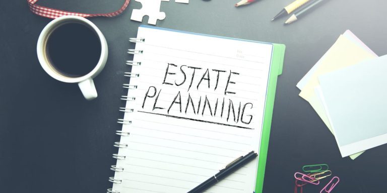 Paper with 'Estate Planning' written on it.