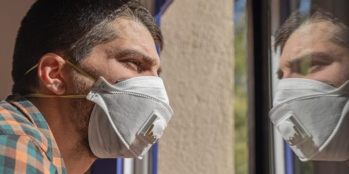 Man wearing a mask during COVID-19 pandemic.